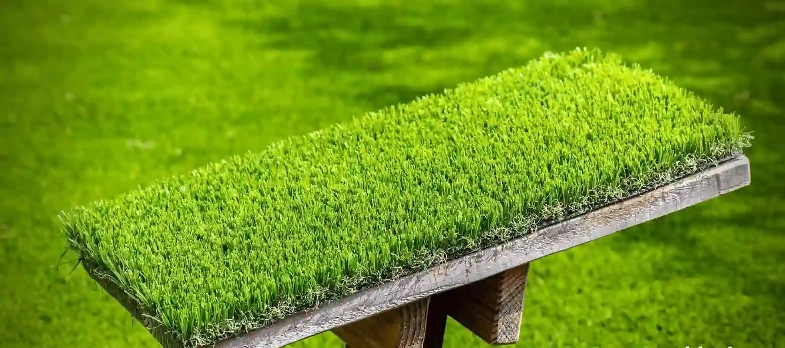 artificial grass garden with a stule stand having artificial grass on it with a hint of DIY.