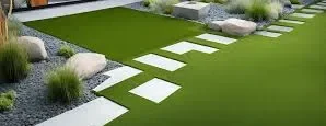 Modern artificial grass and paving ideas featuring large stone pavers, decorative rocks, and low-maintenance landscaping design.